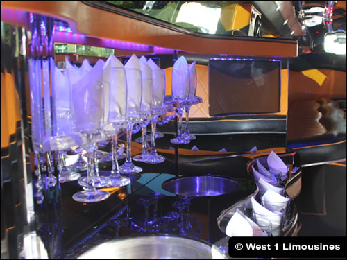 Bar area and ice buckets inside limousine